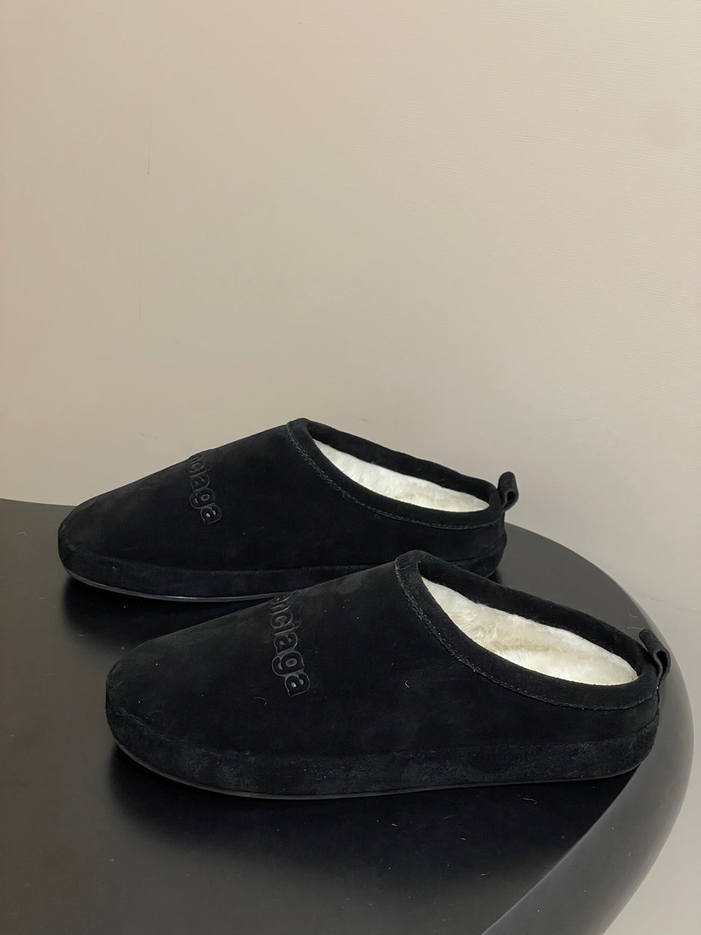 Balenciaga black suede slip-on sandals with open cuff and visible interior lining