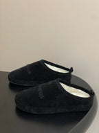 Balenciaga black suede slip-on sandals with open cuff and visible interior lining