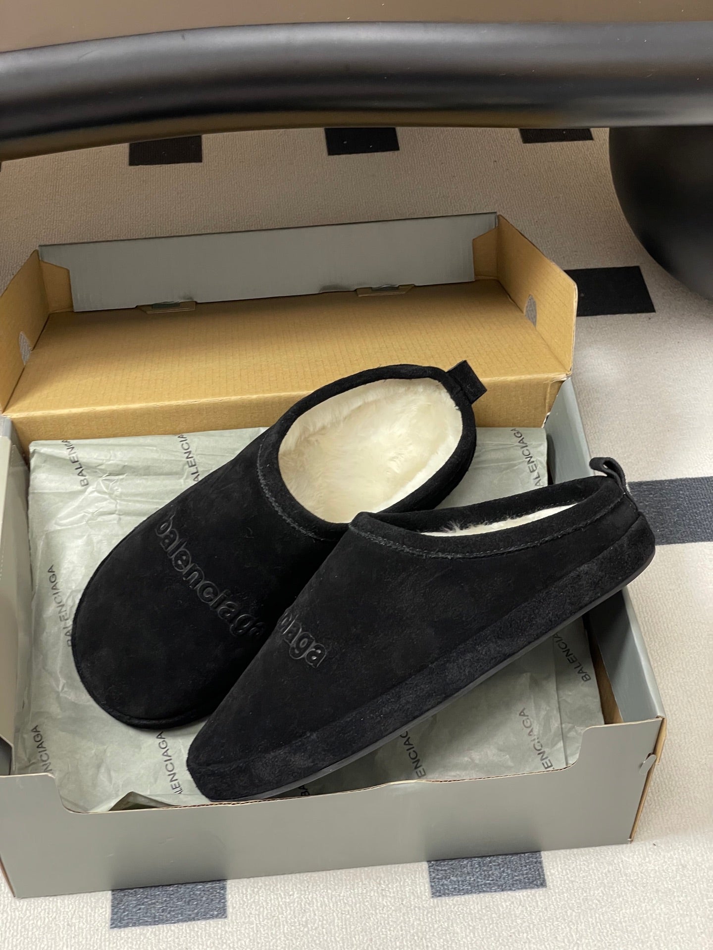 Balenciaga black suede slide sandals in open shoebox with light lining