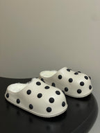 Cream polka-dot slip-on clogs with plush shearling lining and rounded toe