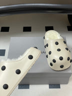 Cream polka-dot slip-on clogs with plush lining and rounded sole