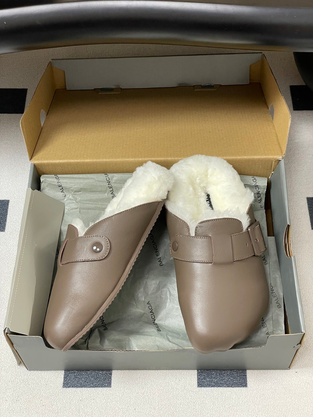 Taupe shearling slide sandals in box with strap and rounded toe