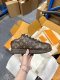 Monogram canvas sneakers with embossed side emblem and dark rubber sole
