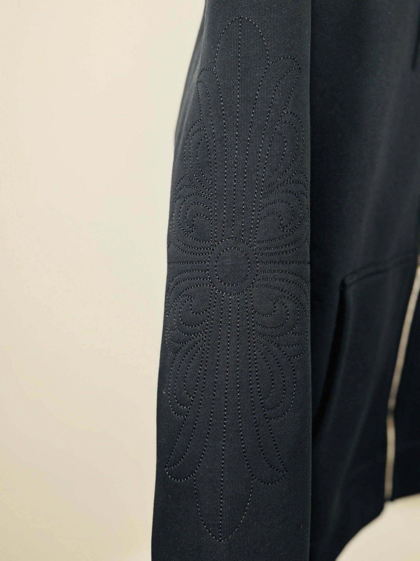 Chrome long dark hoodie sleeve, textured cross pattern embroidery