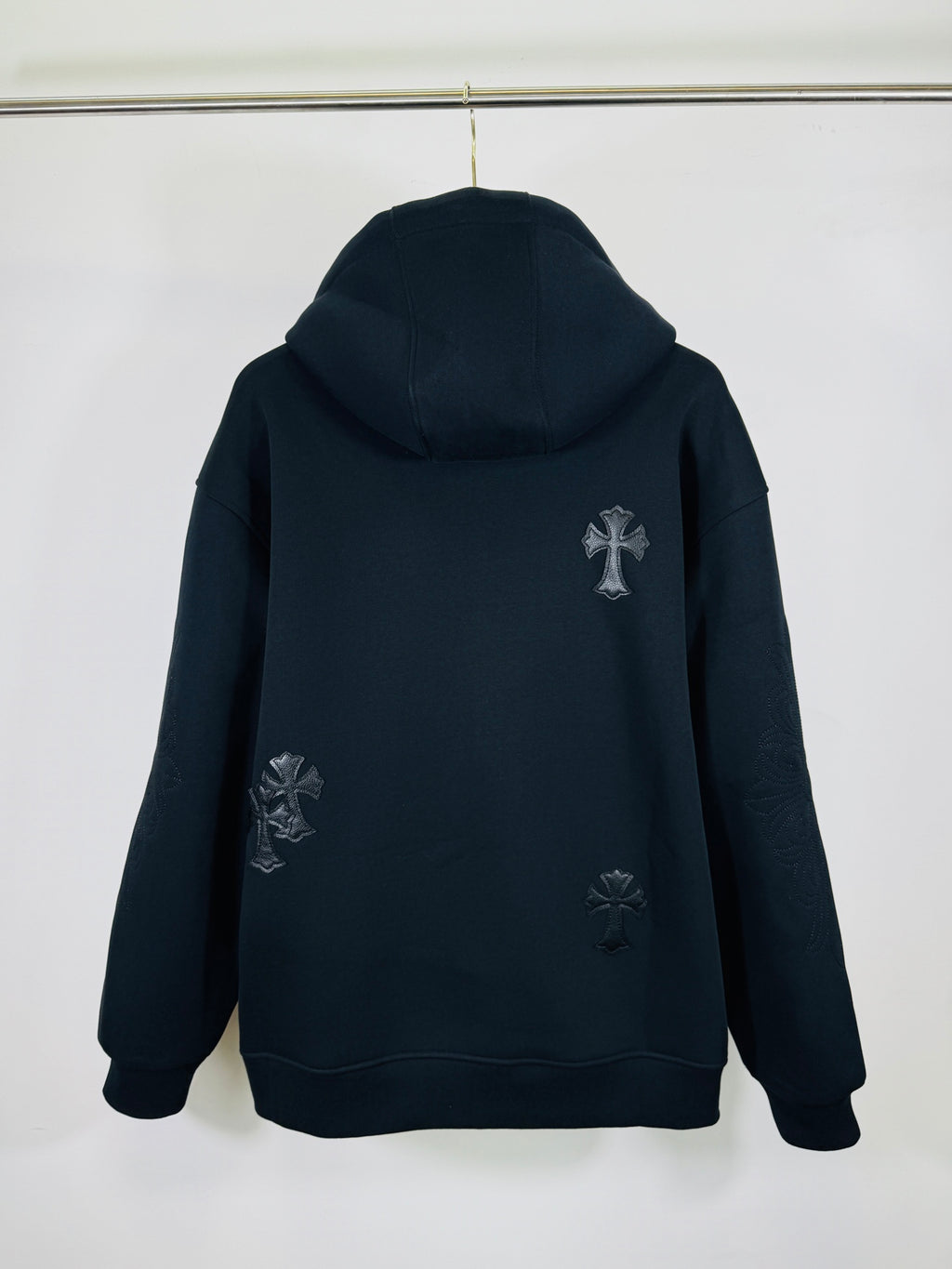 Chrome long dark zip-up hoodie, hooded back view, small cross applique