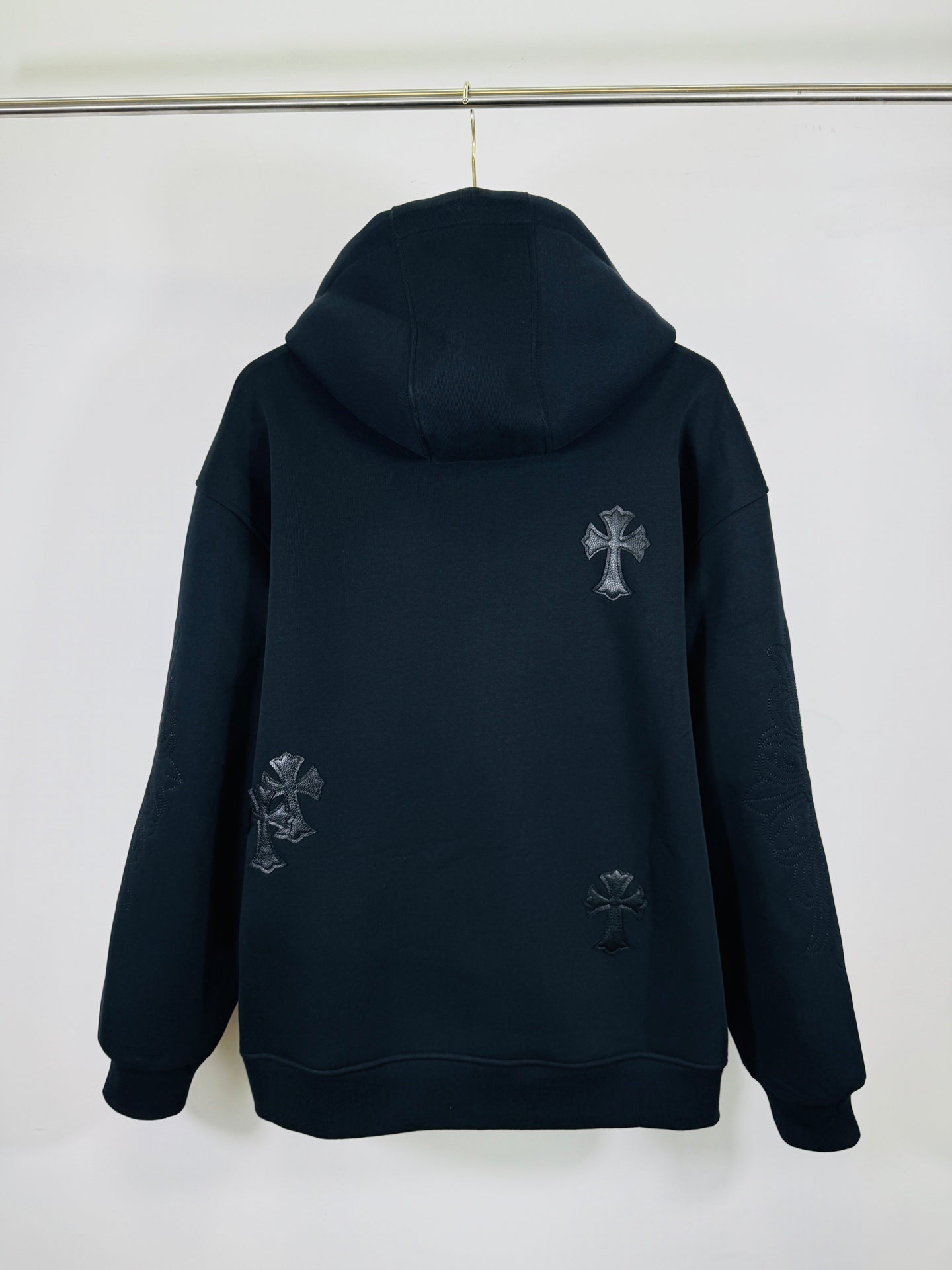 Chrome long dark zip-up hoodie, hooded back view, small cross applique