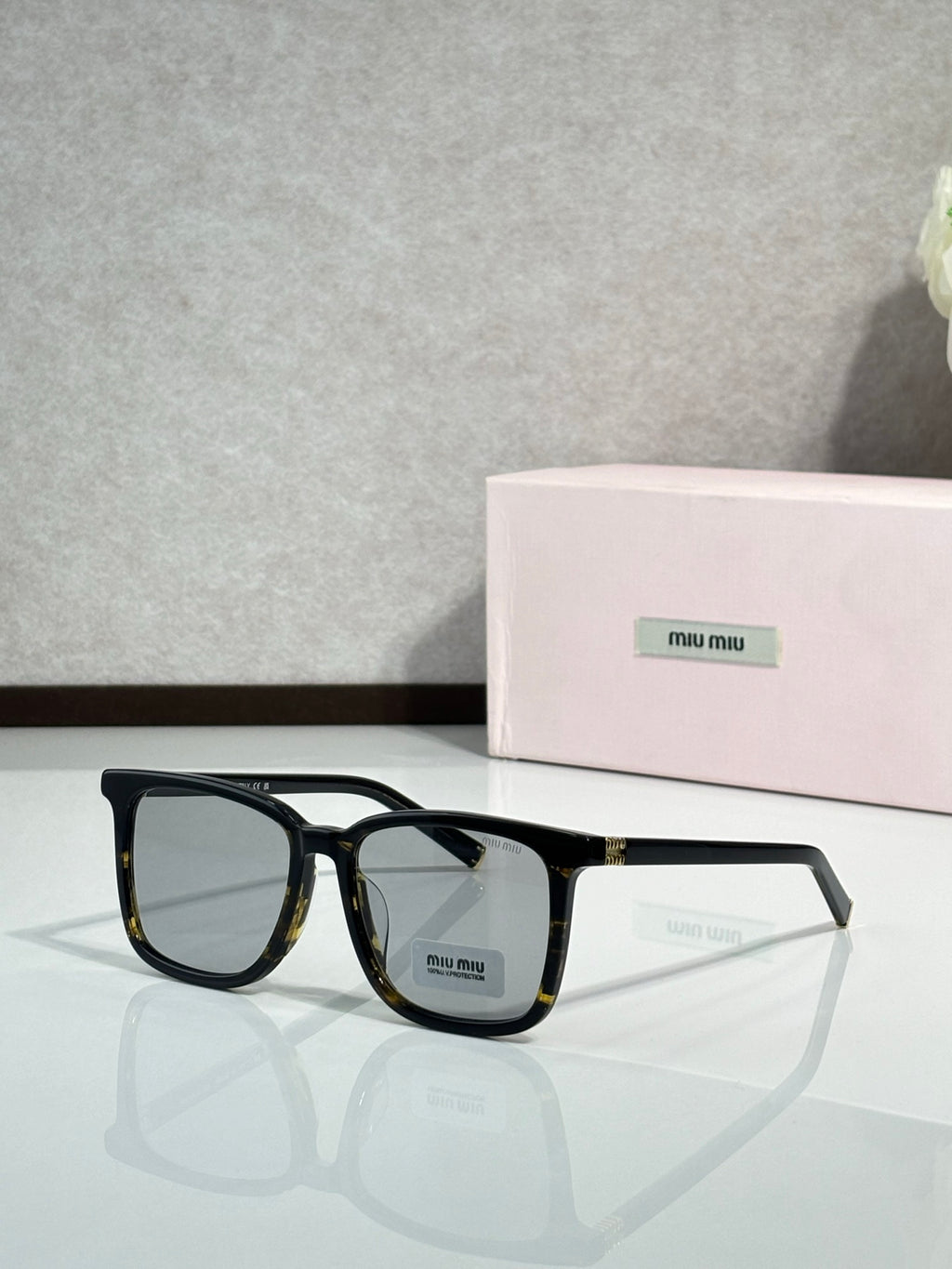 MiuMiu glasses with black frames and clear lenses