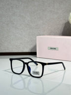 MiuMiu glasses with black frames and blue-tinted lenses