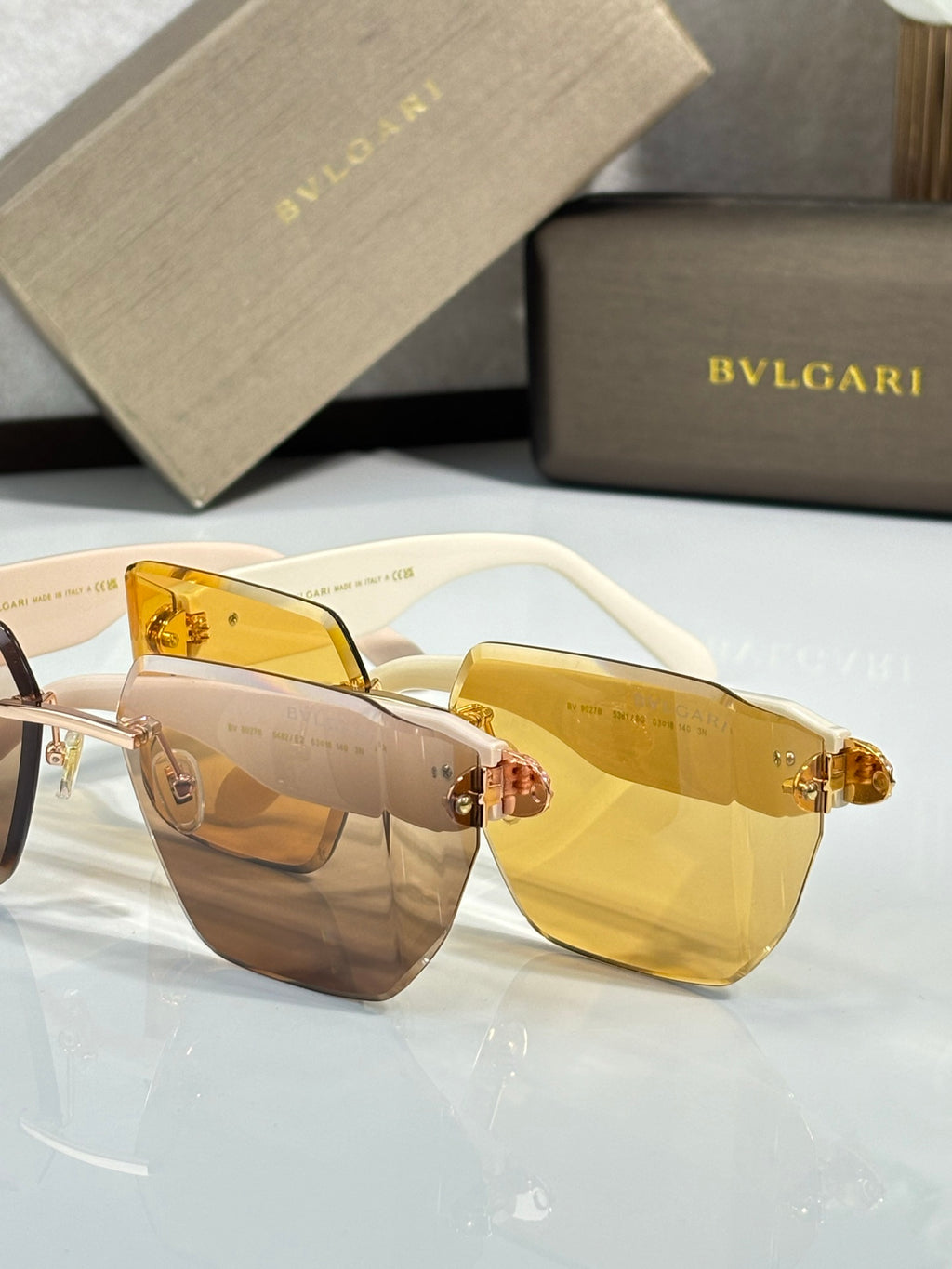 Bvlgari sunglasses with amber lenses and tortoiseshell frame, gold hinge embellishment