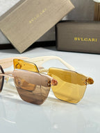 Bvlgari sunglasses with amber lenses and tortoiseshell frame, gold hinge embellishment
