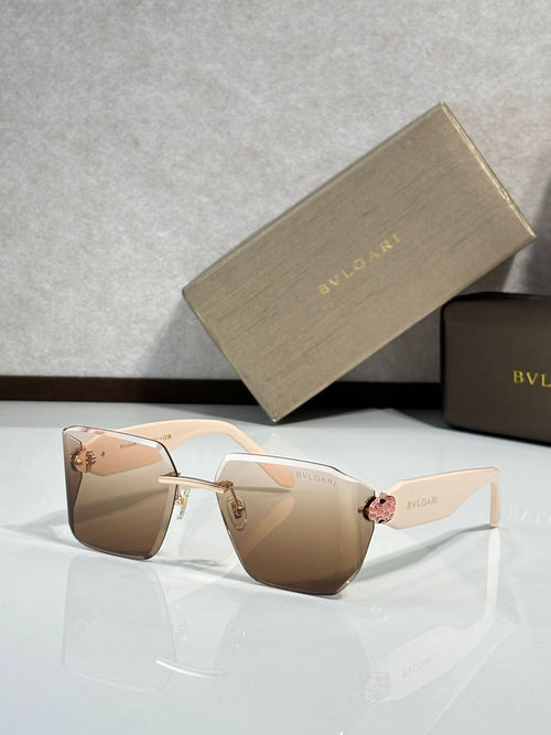 Bvlgari sunglasses with light brown gradient lenses and pale frame, gold-toned bridge