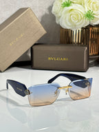 Bvlgari square sunglasses with blue lenses, navy temples, and gold-tone frame