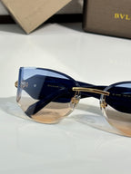Cat-eye sunglasses by Bvlgari with blue-tinted lenses and blue front frame
