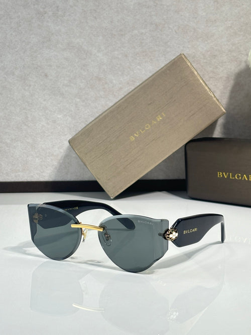 Cat-eye sunglasses by Bvlgari with dark lenses and gold-tone metal bridge