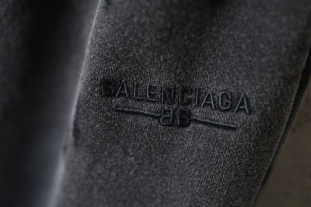 Black pants fabric with BALENCIAGA logo patch detail