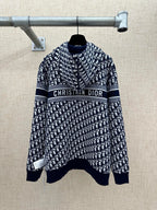 Navy and white patterned zip-up hoodie with “Christian Dior” logo stripe across chest.