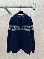 Navy zip-up hoodie with hood and “CHRISTIAN DIOR” stripe band on chest