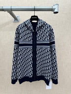 Navy and white patterned zip-up hoodie with striped bands and hood.