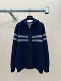 Navy zip-up hoodie with striped bands on sleeves and hem-length body.