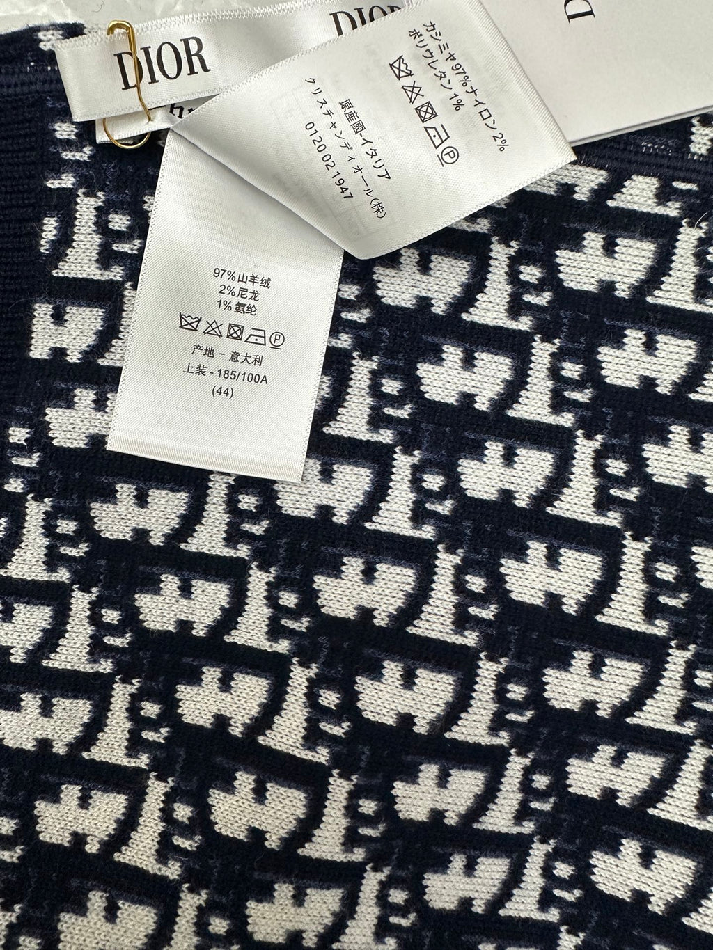 Black-and-white patterned fabric panel from a zip-up hoodie with woven Dior look