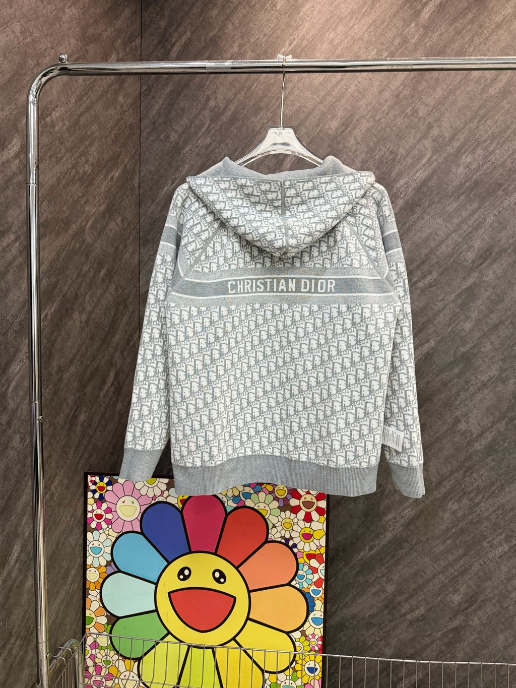 White hooded zip sweatshirt, back view with “CHRISTIAN DIOR” chest band.