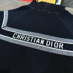 Navy zip hoodie with bold 'CHRISTIAN DIOR' logo stripe across the chest
