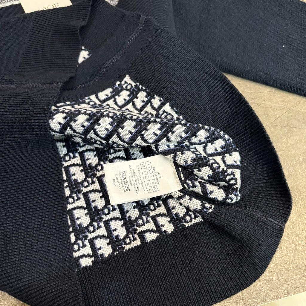 Navy knit hoodie cuff with patterned Dior logo patch and white fabric label