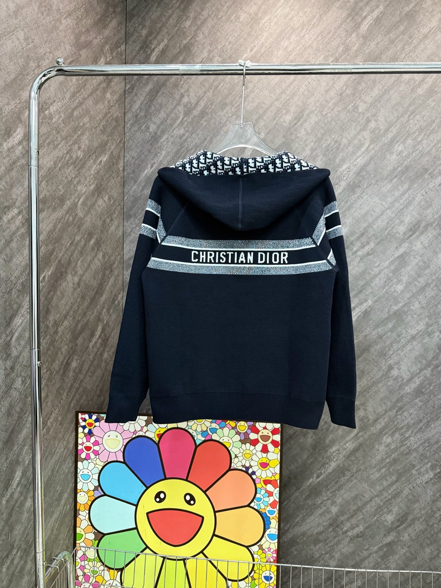 Black hooded zip sweatshirt, back view with “CHRISTIAN DIOR” chest band.
