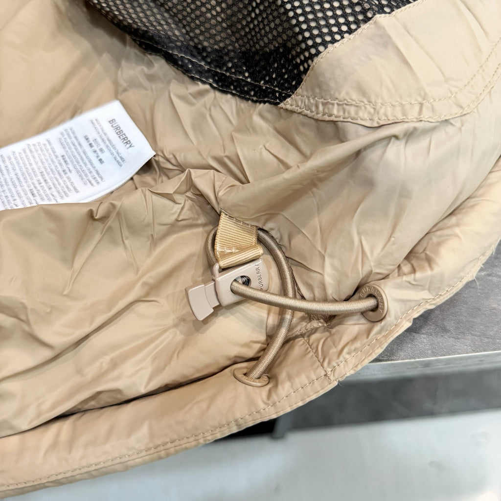 Light beige long coat with adjustable drawstring hood and snap button