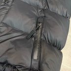 Dark puffer jacket with center zip and stitched quilted panels