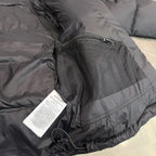 Dark puffer jacket with zip pocket and perforated mesh panel