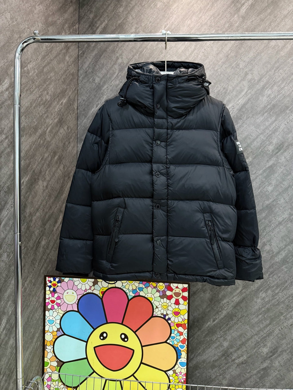 Burberry hooded puffer jacket, dark quilted front with full-length zipper.