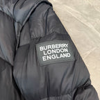 Dark puffer coat with 'BURBERRY LONDON ENGLAND' logo patch
