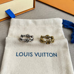 Louis Vuitton jewelry pouch displaying silver- and gold-tone chain rings