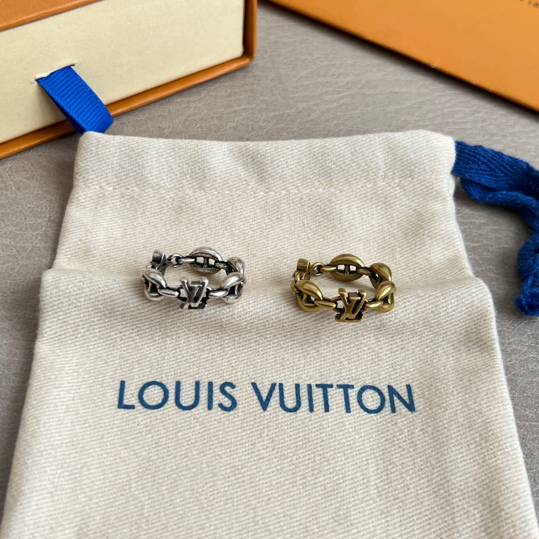 Louis Vuitton jewelry pouch displaying silver- and gold-tone chain rings