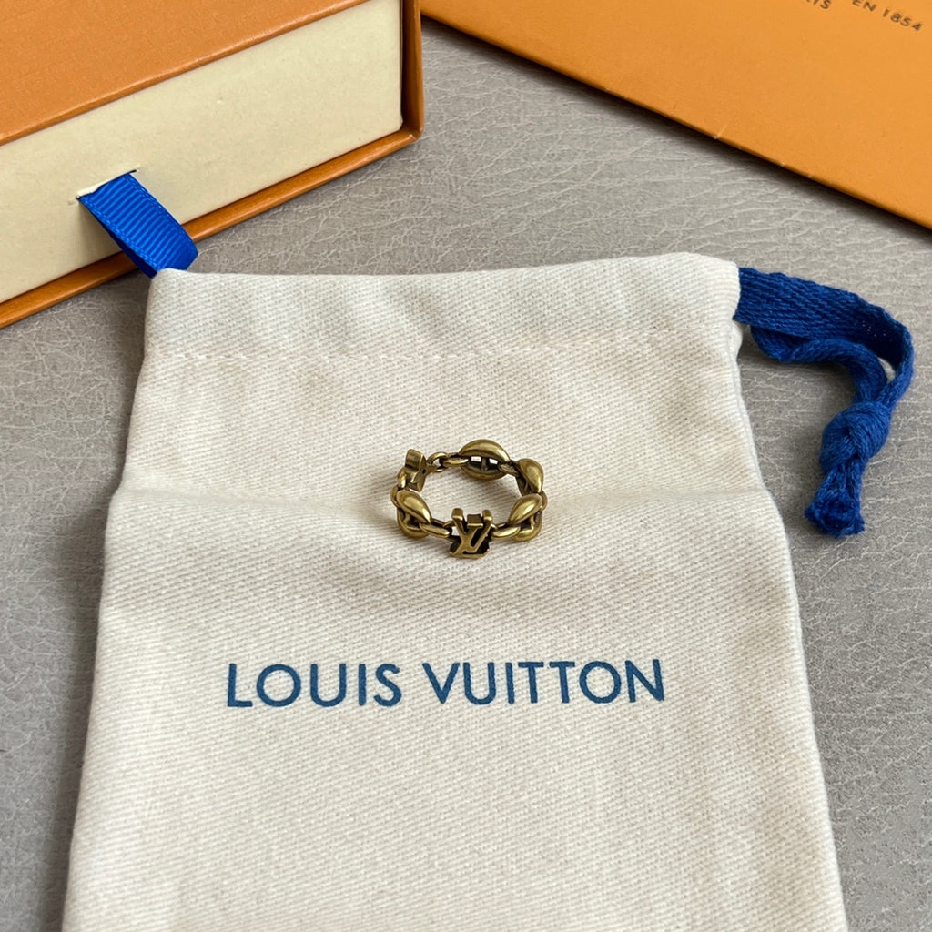 Louis Vuitton jewelry pouch with gold-tone chain bracelet