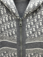 Heather gray zip hoodie detail: metal zipper pull on printed knit