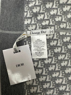 Brand tags attached to patterned zip hoodie fabric