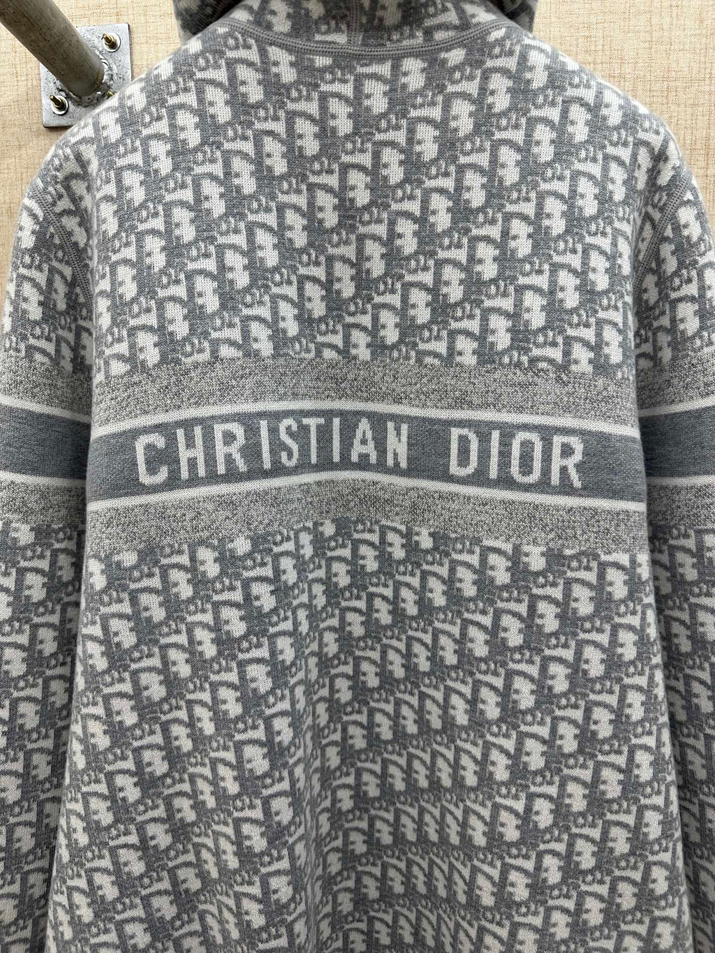 Heather gray zip hoodie detail: Christian Dior logo band on knit fabric