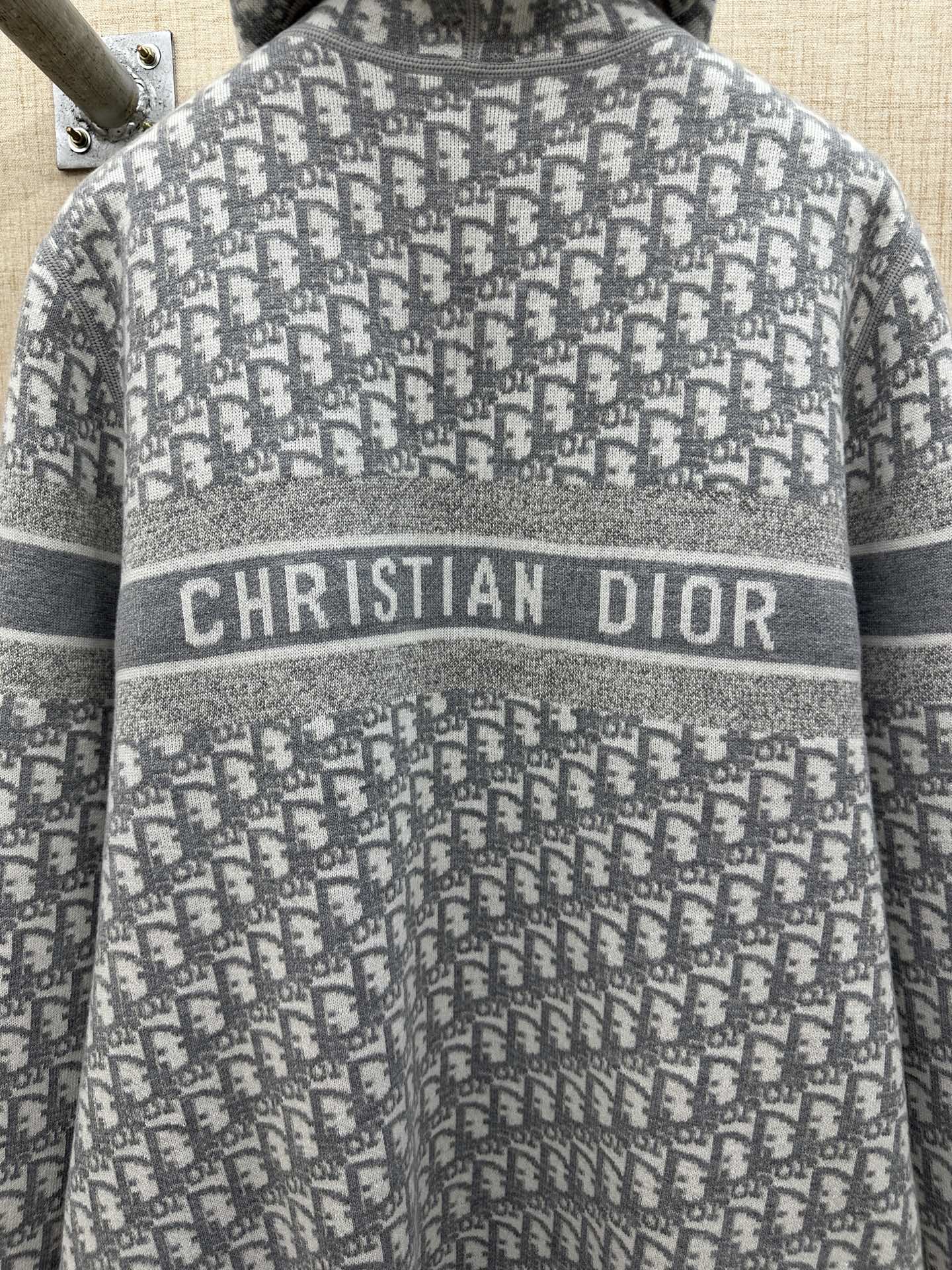 Heather gray zip hoodie detail: Christian Dior logo band on knit fabric