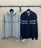 Zip-up hoodies with striped bands, gray and navy, full front zipper and hood.