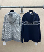 Zip-up hoodies with Christian Dior logo text, gray and navy, full zipper and hood.