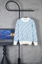 Dior long-sleeve knit sweater with white base and blue repeating logo pattern