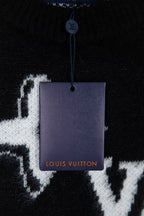 Louis Vuitton sweater neckline detail with hang tag on black knit