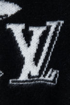 Louis Vuitton sweater close-up, large white LV monogram graphic on black knit