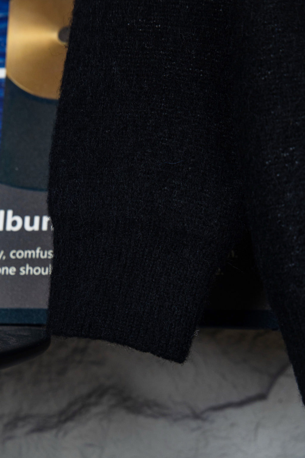 Louis Vuitton sweater sleeve and hem, black knit with ribbed cuff