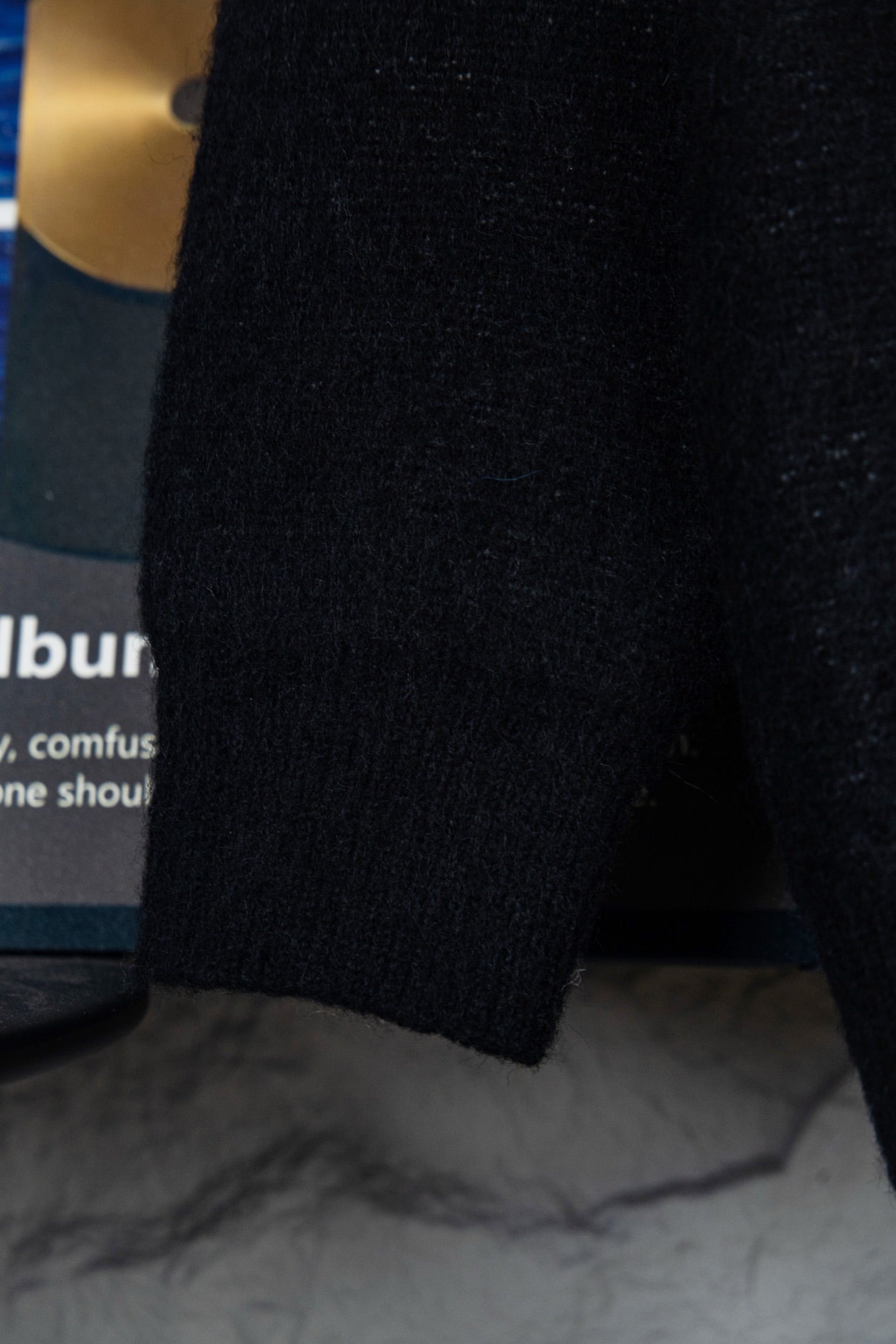 Louis Vuitton sweater sleeve and hem, black knit with ribbed cuff