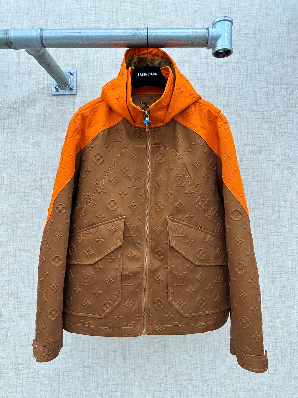 Louis Vuitton hooded jacket with orange hood and brown monogram pattern, zip front