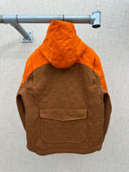 Louis Vuitton hooded jacket with large orange hood and brown monogram pattern, zip front