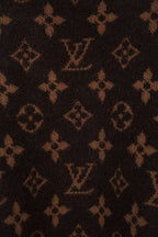 Dark brown monogram knit fabric with repeated logo pattern